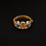 Key of life and lotus inside the serpents bangle with lapis turquoise and coral stones