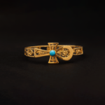 Key of Life bangles with an inside scarab and lotus, featuring a turquoise stone